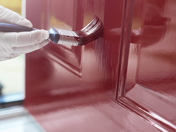 Front Door being painted red Painting With a Brush